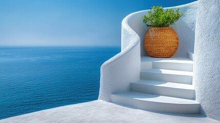 White building with stairs and a blue sea view on a sunny day