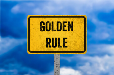 Golden rule message written on yellow metal sign. Conceptual golden rule symbol. Copy space.