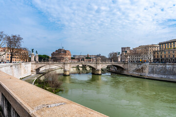 View from Lungotevere in Sassia of the Tiber River with Ponte Vittorio Emanuele II and Castel...
