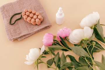 Spa products for facial and body care. Soft terry towel with soap and serum.