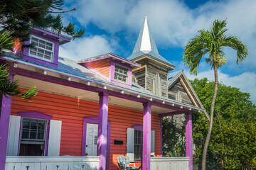 Colorful Conch house with a tropical backyard, vibrant colors architecture in Bahama village, Key West, Florida