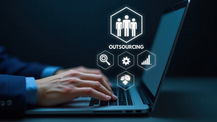 Business professional typing on laptop with outsourcing concept icons and text "Outsourcing" displayed on screen