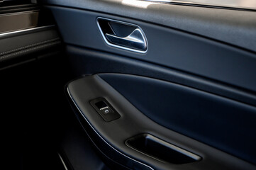 Car door with door handle and window control and adjustment button