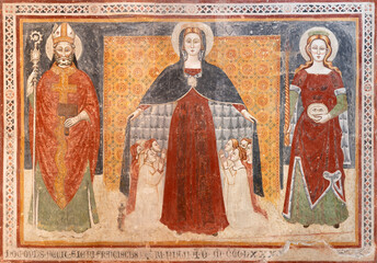 Assisi - The medieval fresco of Virgin Mary with the saints Biagio and Lucia in the church Chiesa...