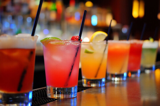 Bartenders engaging in training for drink mixing at a bustling hospitality setting during an interactive class