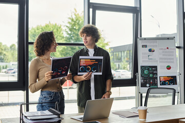 Engaging discussion about project data in a modern office space during a productive workday