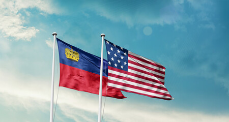 Liechtenstein and America friendship flags are waving in the sky.Two country flag for agreement or deal. Liechtenstein USA national flag for comittment.