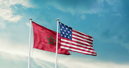 Morocco and America friendship flags are waving in the sky.Two country flag for agreement or deal. Morocco USA national flag for comittment.