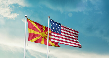 North Macedonia and America friendship flags are waving in the sky.Two country flag for agreement or deal. North Macedonia USA national flag for comittment.