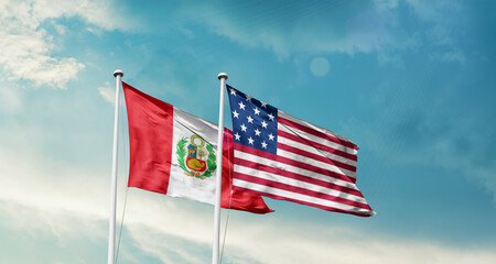 Peru and America friendship flags are waving in the sky.Two country flag for agreement or deal. Peru USA national flag for comittment.