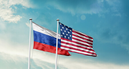 Russia and America friendship flags are waving in the sky.Two country flag for agreement or deal....
