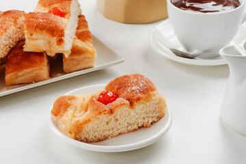 Fototapeta na wymiar coca de sant joan, typical of spain, and hot chocolate