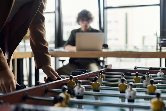 Engaging in playful moments during a busy workday in a modern office setup