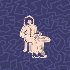 women sits at a table in a cafe