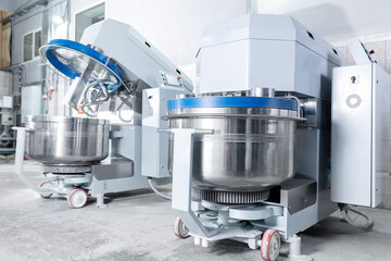 Industrial dough mixing machines in confectionery production facility