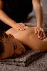 Obraz premium Relaxing massage therapy for young caucasian woman