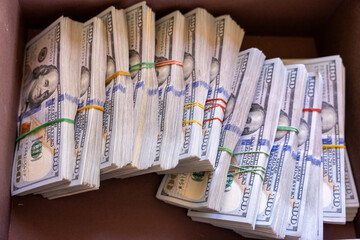 A pile of money is in a box