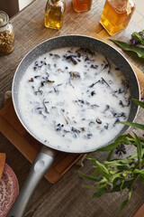 Homemade production of comfrey root ointment using rendered pork lard