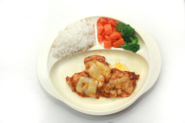 chicken stew topped with cheese with rice and vegetables