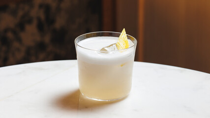 Classic cocktail Ammareto sour on the bar counter. Without people	
