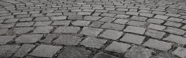 old European city, background and texture, Paving stone pavement  Cobblestone pavement top view. Old stone sidewalk. Paving texture. Cobble stone road cobble texture. Cobblestone background. pavement