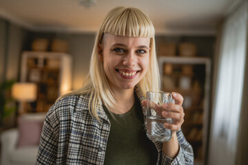 one woman beautiful adult female at home with glass of water