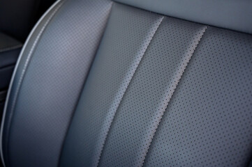 Close-up of black leather seat of modern car