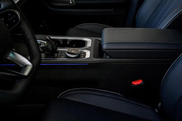 Automatic transmission selector in the interior of a modern car.