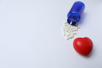 pills in jars on a white background