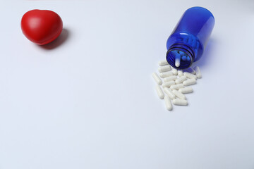 pills in jars on a white background
