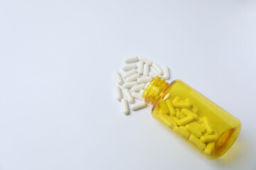 pills in jars on a white background