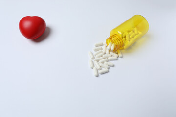 pills in jars on a white background