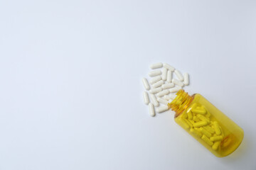 pills in jars on a white background