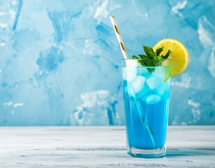 A refreshing blue cocktail garnished with lemon and mint, served on a wooden table against a textured blue background, evoking a cool, summery vibe.