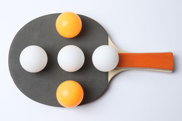 Ping pong racket with the ball for playing table tennis on a colored background