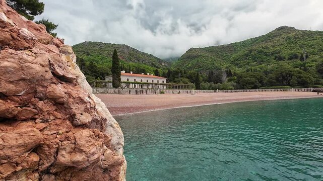 Milocer beach palace bay Montenegro Budva Stari Bar Sveti Stefan Europe Mediterranean Adriatic Sea blue waters Spring holiday vacation cloudy mountains 