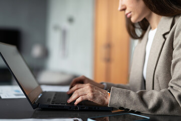 Business woman with laptop working in the office