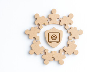 Wooden puzzle pieces form circle around shield symbolizing life health insurance protection teamwork and security concept