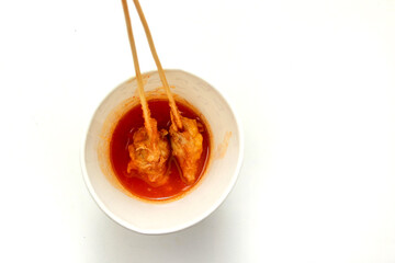 Sempol is Indonesian street food made from chicken cassava flour, some seasonings, and egg, dip in sauce