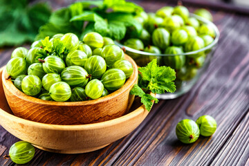 Green Organic Berries Gooseberries.Green gooseberries in a wooden bowl.Gooseberries on the wooden table. Harvest concept. Vegetarian food.