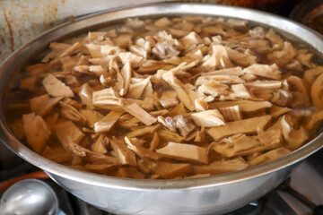 Bamboo shoot boiled with pork bones soup in a large pot.