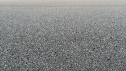 Shallow focus view of asphalt road surface. For background and textured.