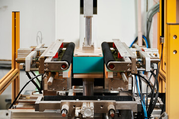 Innovative semi-automatic wrapping machine efficiently processes rectangular boxes in a modern...