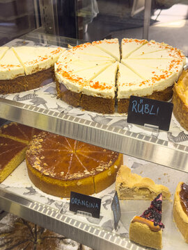 Freshly baked carrot cake and orange cake slices. Perfect for a sweet treat!