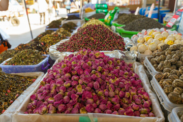 A table with many different colored flowers