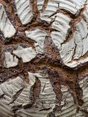 High-resolution image of artisan sourdough bread crust. Perfect for baking blogs, food websites, and culinary projects.