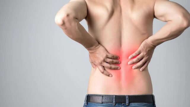 Man with lower back pain and muscle discomfort highlighted in red