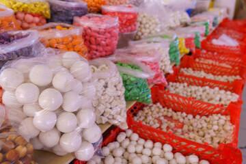 A table with many bags of food on it