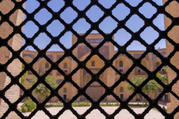 Fototapeta premium A view of a building with a black metal fence