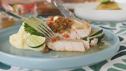 Grilled fish fillet with creamy mashed potatoes zucchini lime and parsley Fish dish for gourmet projects showing juicy fish texture elegant plating healthy balanced meal fish cuisine concept